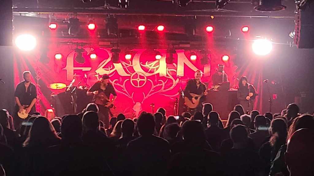 Another shot of the band on stage, featuring Alex, Stephan, Oliver, Niel, and Adaya. 